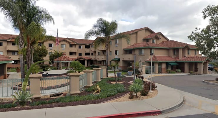 View of Canyon Villas senior living facility with landscaped grounds.