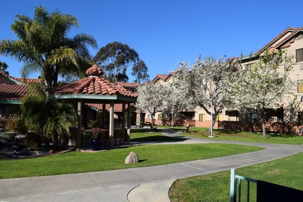 Scenic view of gardens with pathways at Canyon Villas senior living facility.