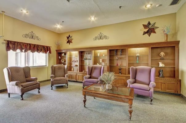 Cozy living room with seating and decorative shelves
