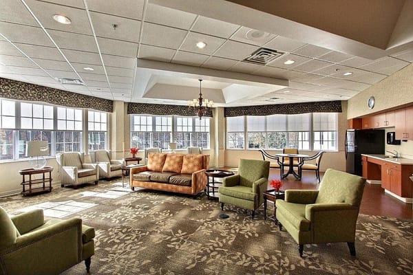 Bright common area with seating and windows