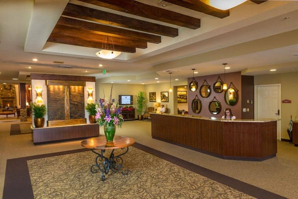 Lobby area with front desk and floral decor