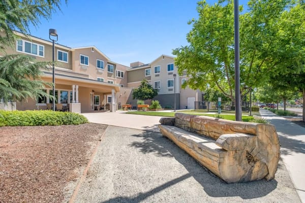 Outdoor space with a seating area and trees