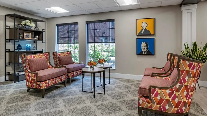 Bright common area with colorful seating and artwork