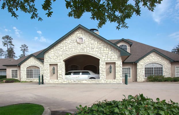 Building exterior with a vehicle at the entrance