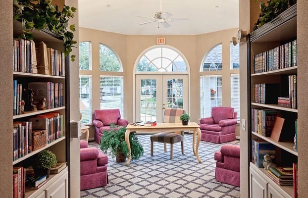 Cozy common area with bookshelves and seating