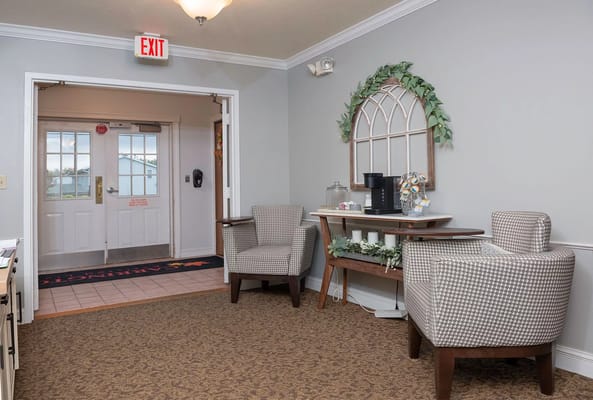 Cozy lobby with chairs and a coffee station