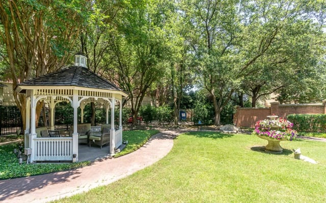 A serene garden gazebo surrounded by trees