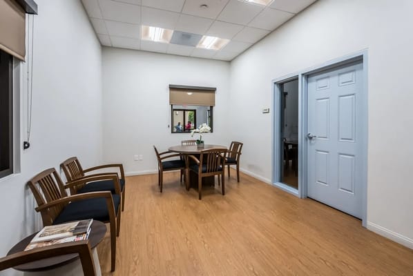 Bright interior room with chairs and a table