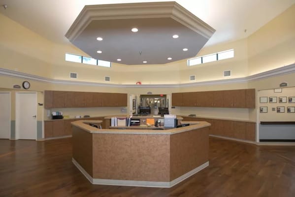 Interior view of a reception area with wooden counters