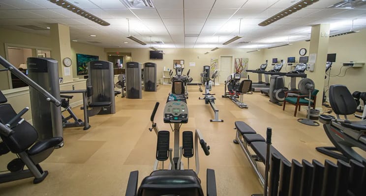 Interior view of a fitness center with various equipment