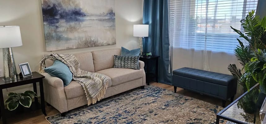 Cozy interior living area with a sofa and lamps