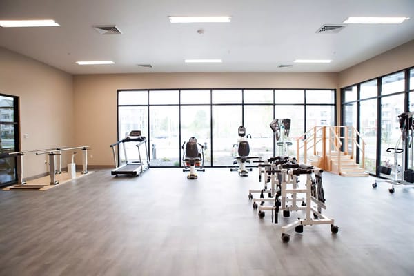 Interior view of a therapy room with exercise equipment