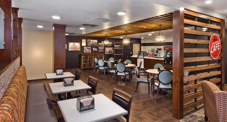 Bright, modern dining area with tables and chairs