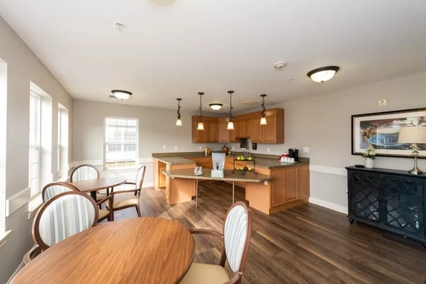 Bright dining room with kitchen area and seating