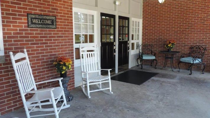 Welcoming entrance with rocking chairs and a small table