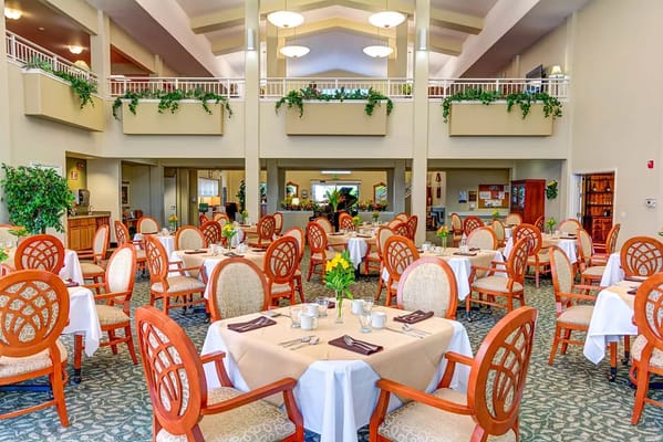 Dining area with tables and chairs set for a meal