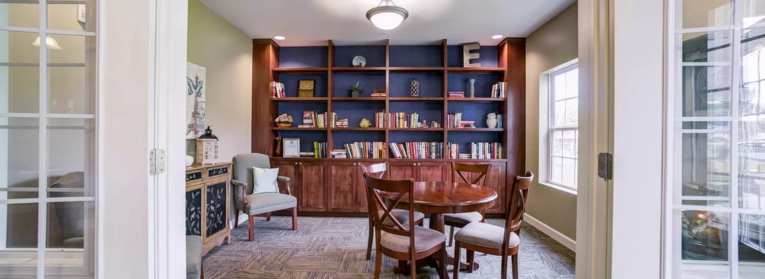 Cozy common area with bookshelves and seating