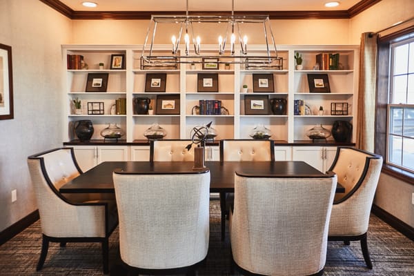 A cozy common area with a modern dining table