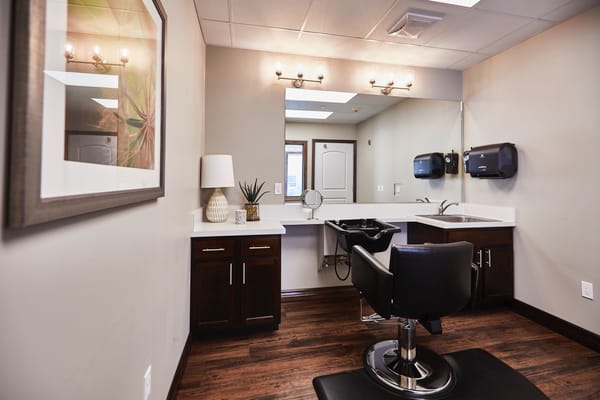 Beauty salon chair and mirror in a bright room