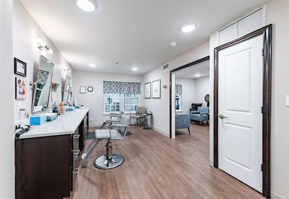 Interior of a salon area with mirrors and chairs