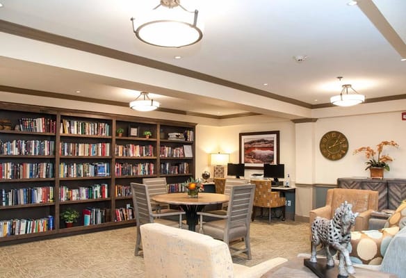 Cozy common area with bookshelves and seating