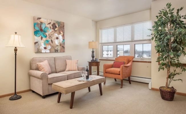 Cozy living room area with seating and art