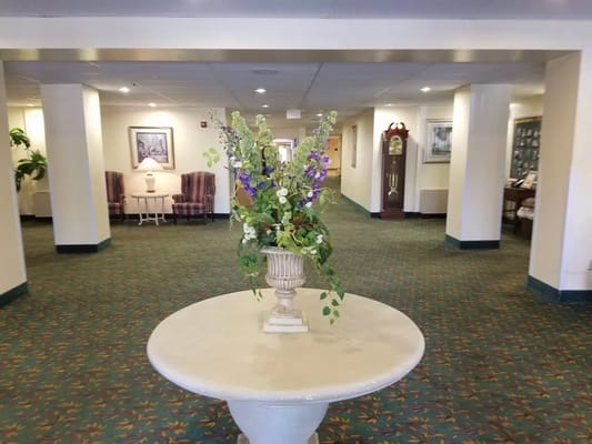 Interior view of a common area with floral arrangement