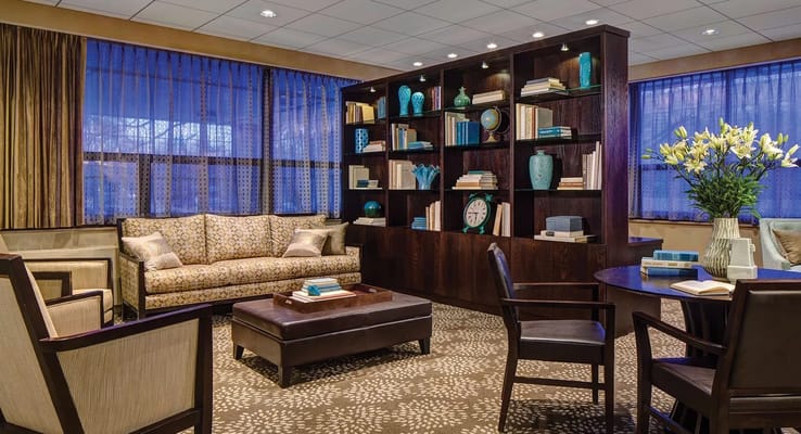 Welcoming common area with seating and bookshelves