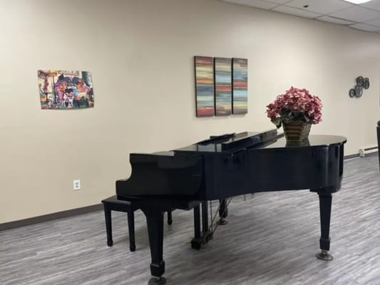 Interior view of a common area with a piano