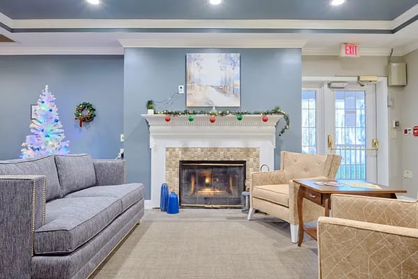 Cozy common area with fireplace and holiday decor