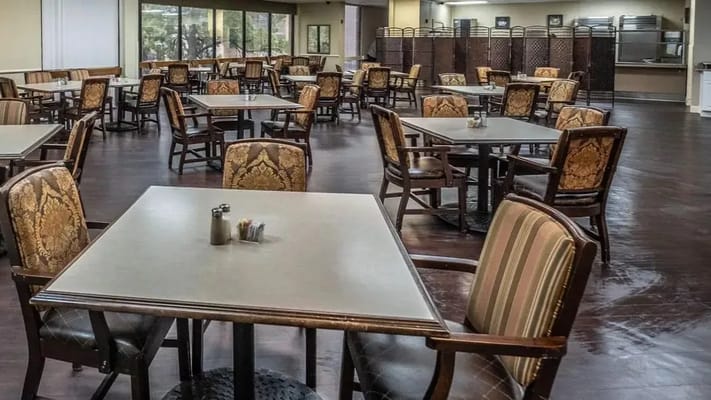 Interior view of the dining room with tables and chairs