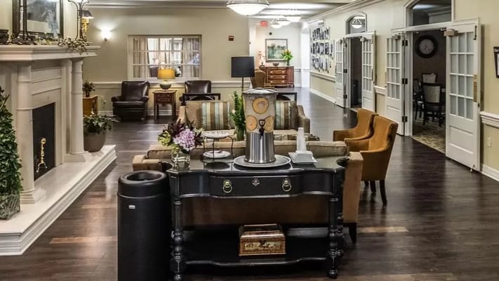 Common area of a senior living facility with seating and decor