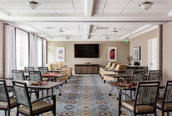 Interior common area with seating and game tables