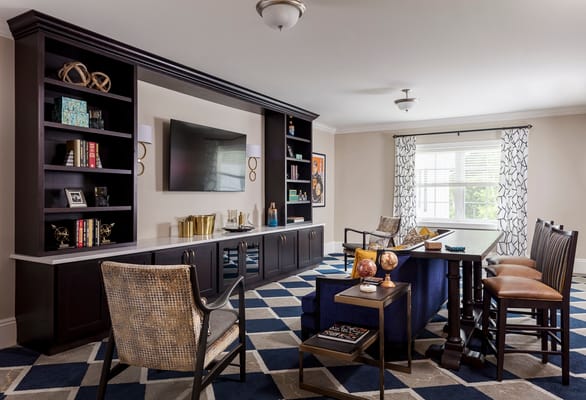 Bright common area with seating and decorative shelves