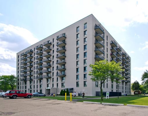 Exterior view of Cityview Senior Tower with residents outside
