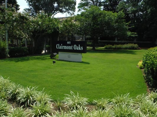 Signage for Clairmont Oaks outside in a landscaped area