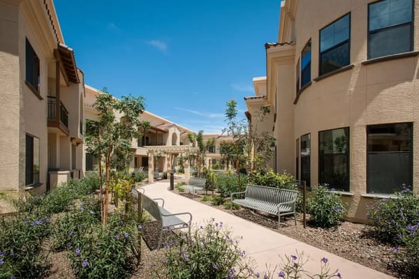 Outdoor courtyard with seating and landscaping