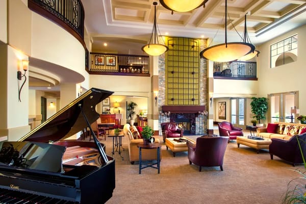 Stylish common area with seating and a piano