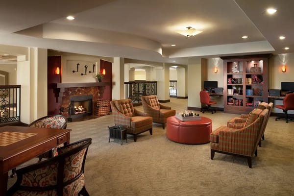 Cozy common area with seating and chess table