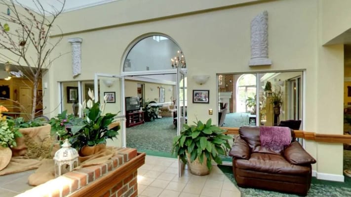 Interior view of a common area with plants and seating