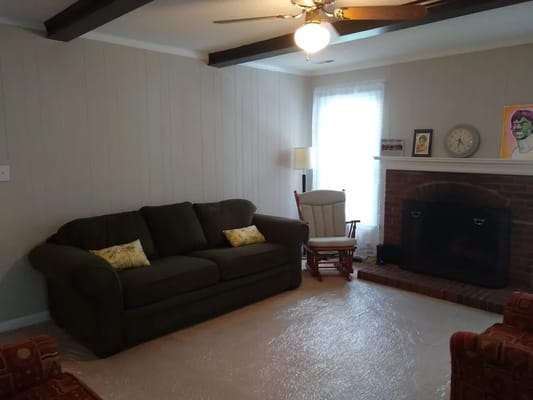 Cozy living room with a couch and fireplace