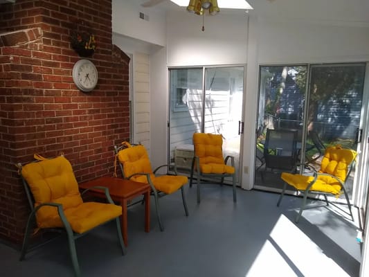 Bright common area with seating and brick walls