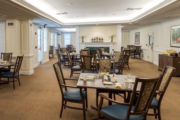 Interior view of the dining room with tables set for breakfast.