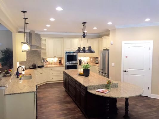 Spacious kitchen with granite countertops and modern appliances