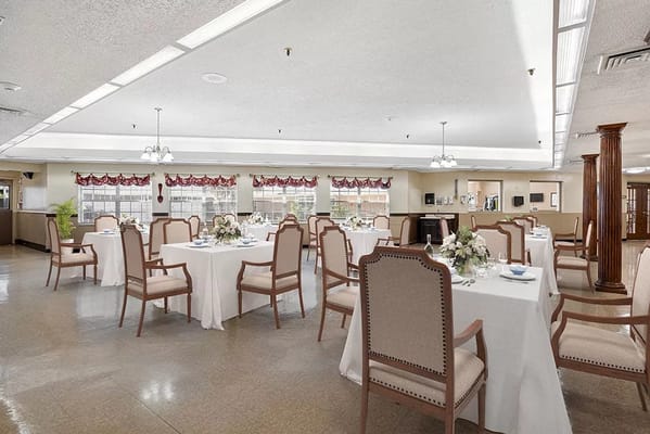 Dining area set with tables and chairs for residents