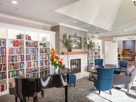 Cozy common area with seating and bookshelves