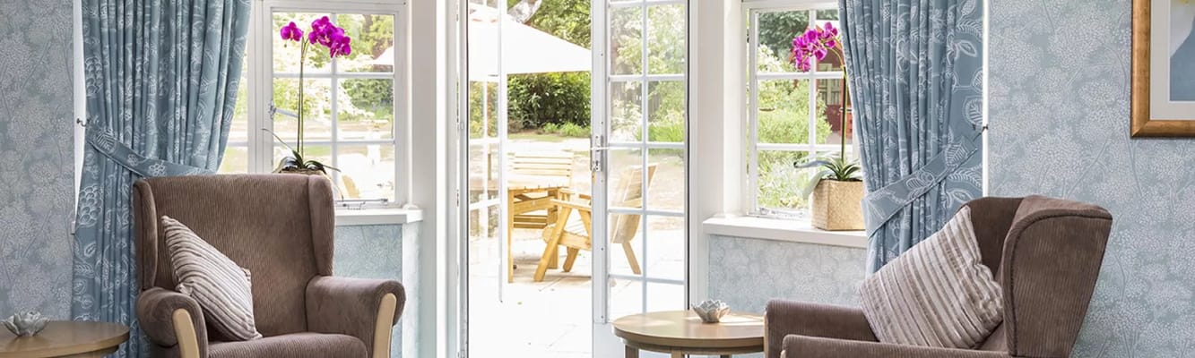 Interior view showing a cozy common area with chairs
