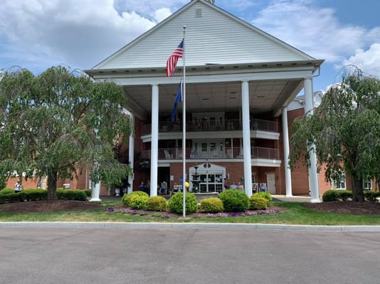 Exterior view of Colonial Heights Senior Living building with gardens