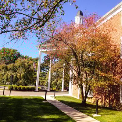 Exterior view of Colonial Heights Senior Living with autumn foliage