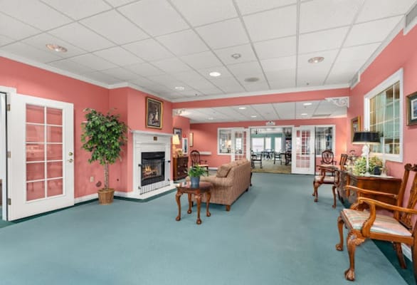 Interior view of a cozy common area with a fireplace